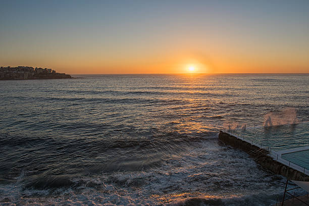 Sunrise on the Bondi Beach Sydney NSW Australia Bondi Beach is a popular beach and the name of the surrounding suburb in Sydney, New South Wales, Australia bondi beach sunrise stock pictures, royalty-free photos & images