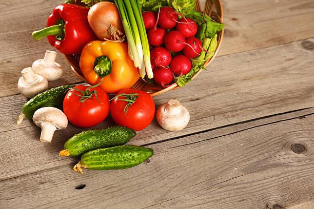 istock Fresh vegetables on a clean wooden table 622512254
