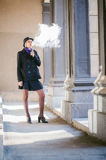 istock woman  smoking an electronic cigarette 622512774