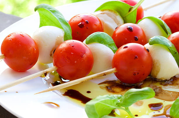 Caprese salad skewers Traditional Italian salad- caprese salad skewer caprese salad stock pictures, royalty-free photos & images