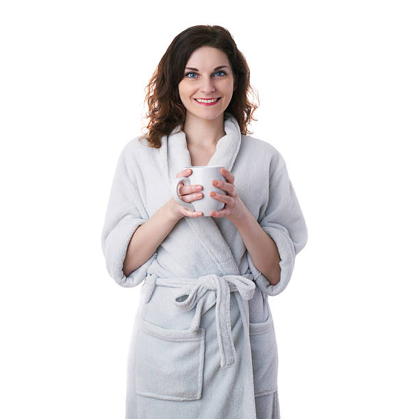 istock Young woman in bath robe over white isolated background 622513198