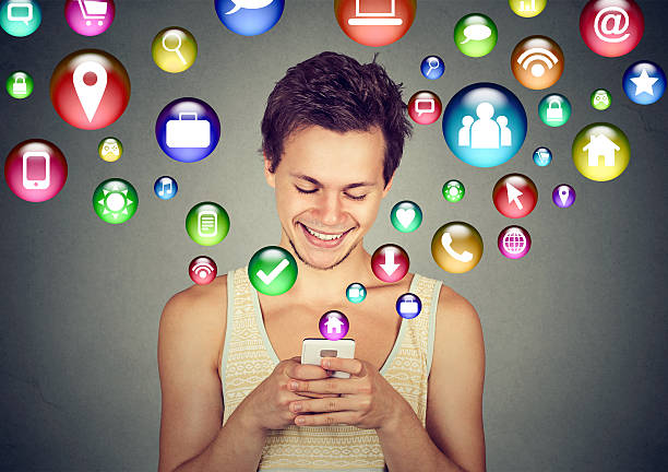 istock man using smartphone social media application icons flying up 622513992
