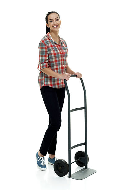 istock Smiling female holding hand truck 622514280
