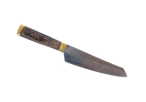 istock Old knife with brass and bone handle isolated on white 622514758