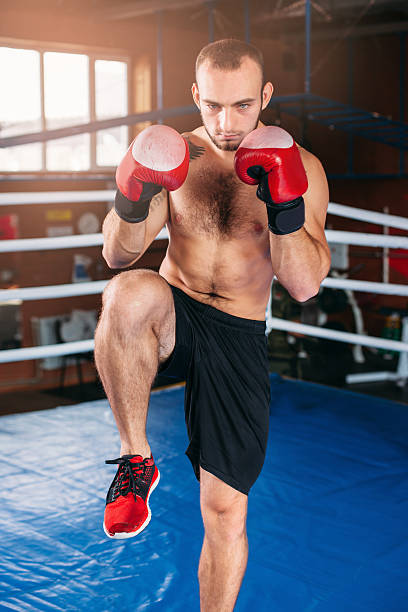 istock Muscular man boxing in gym befor fighting. 622515910