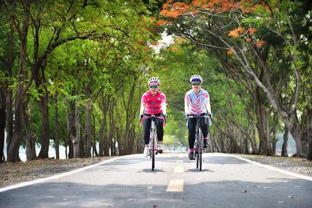 Photo of Two sportswoman ride bike