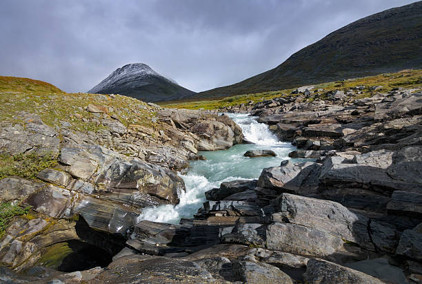 The view from the hiking trail in Joutunheimen National Park in Norway on a sunny day in autumn (late September). The image was captured with a full frame DSLR camera with a fast, sharp lens at low ISO resulting in a large, clean file. The image is part of a large series of photographs of Jotunheimen at various seasons.