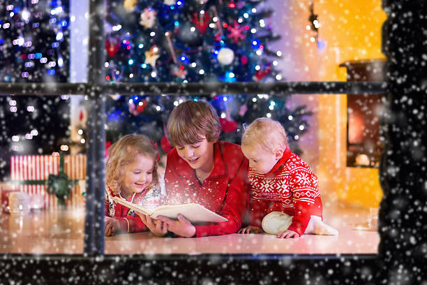istock Kids playing at fireplace on Christmas eve 622523880