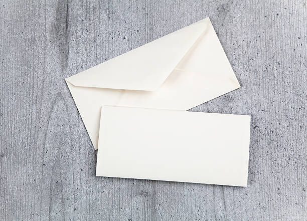 istock Envelope and card on wood background 622529172