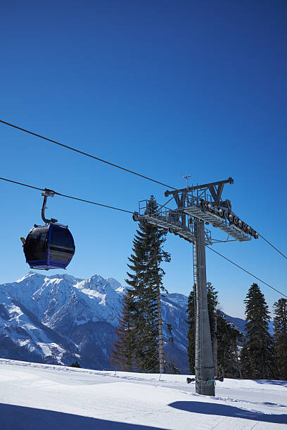istock ski resort panorama with cable car lift cabin. Snow mountain 622529992