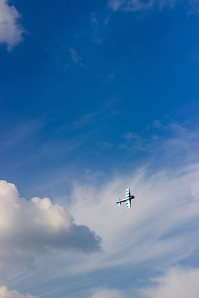 istock Radio controlled toy airplane against blue sky with white clouds 622531454