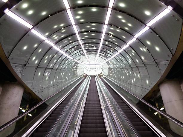 istock escalator in glass tunnel 622536250