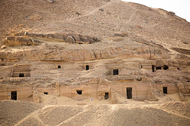 Aswan, Egypt - July 21, 2016: The hill overlooking Aswan on the Nile River, with the Tombs of the Nobles (Old & Middle Kingdom Tombs) dug into the slopes of the geological feature.