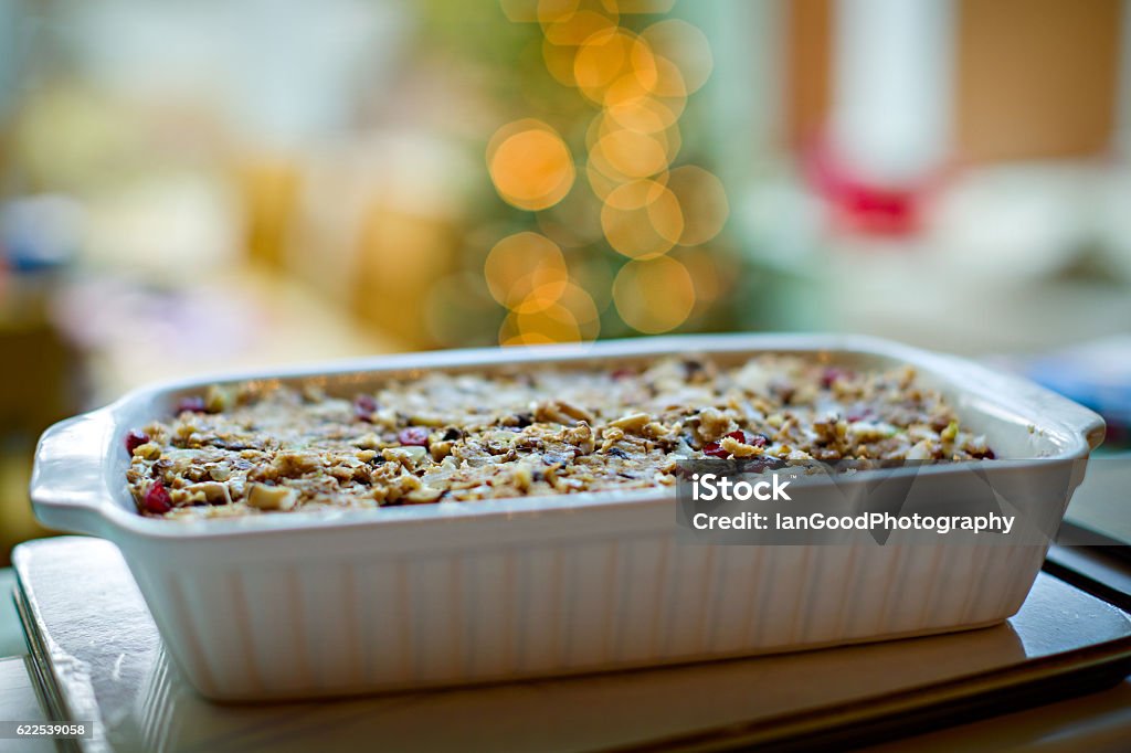 Nut Roast Nut roast in a baking dish with narrow depth of field and bokeh from Christmas tree lights in the background. Nut - Food Stock Photo