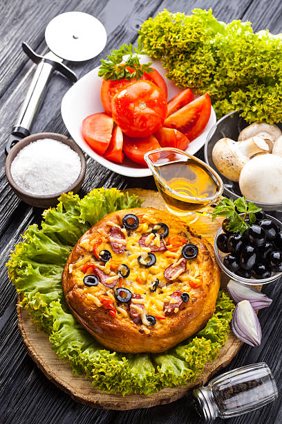 istock Delicious Homemade pizza served on wooden table 622542178