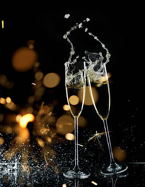 istock Champagne Glasses With Sparkler And Defocused Lights 622543956