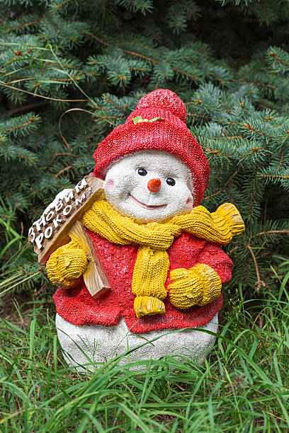 istock Toy snowman at fir 622546350