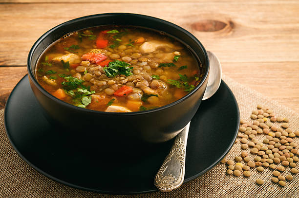 hot soup with green lentil, chicken, vegetables and spices. - green lentil imagens e fotografias de stock