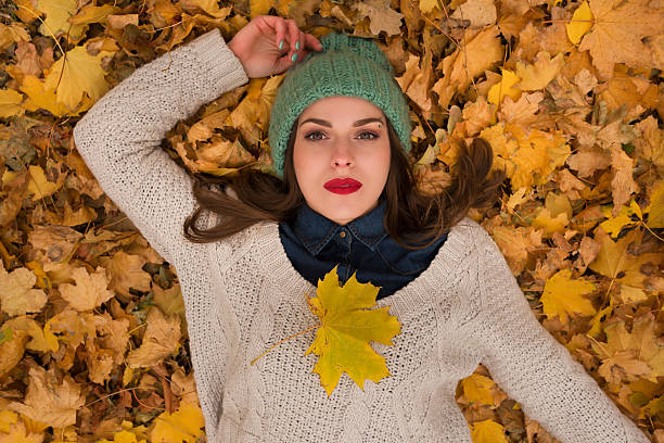 istock Woman in the autumn leaves 622548272