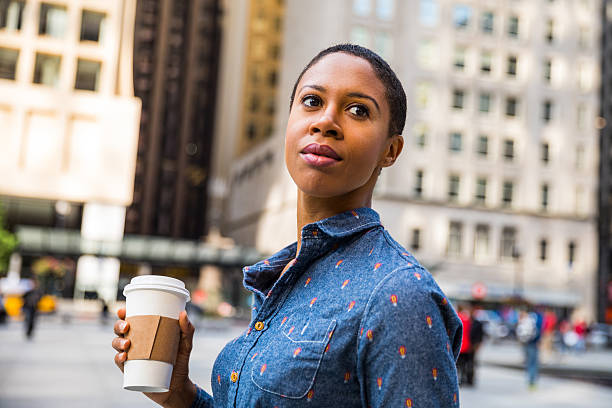 istock Woman having a break in city downtown drinking a coffee 622548630