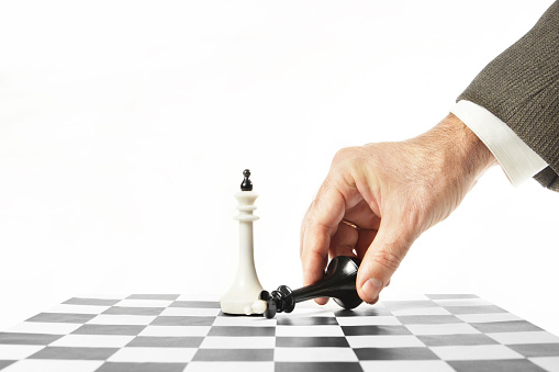 Man surrenders in chess game. Concept of defeat and failure