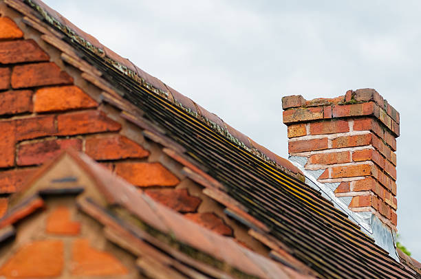 istock Damaged chimney needs repair old rooftop building exterior 622767452