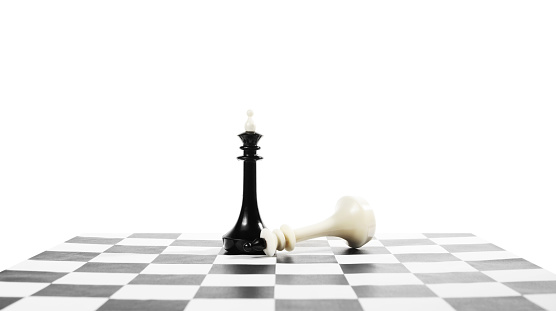 Success and failure. Fallen chess king near another one. Concept with chess pieces against white background