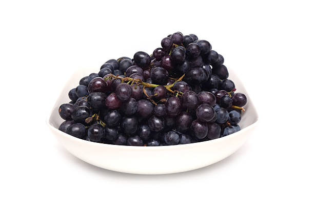 istock Ripe grape bunches in white bowl isolated 622768556