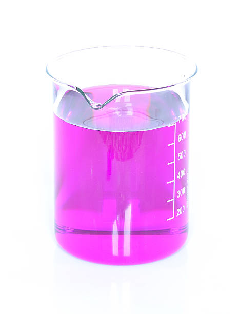 istock Chemical beaker with permanganate dissolved in water 622768620