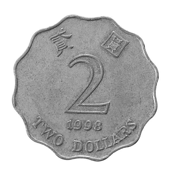 Hong Kong dollar Two Hong Kong dollar isolated on white background closeup hong kong currency symbol stock pictures, royalty-free photos & images