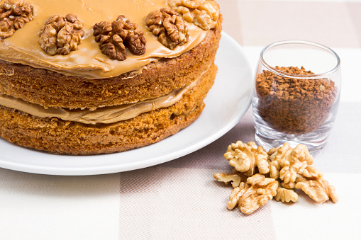 A traditional coffee and walnut cake covered with butter cream