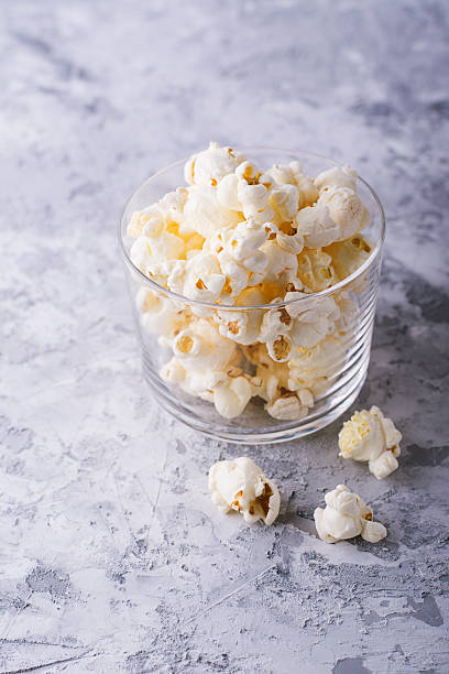 istock Popcorn in glass bowl on white background. 622777382