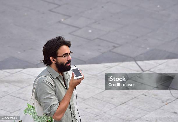 Man With Style Using Mobile Smart Phone Stock Photo - Download Image Now - Activity, Adult, Arts Culture and Entertainment
