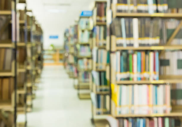 istock Blurred books on bookshelf in public library for background 622781686