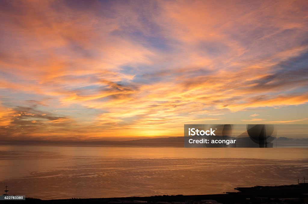 Sunrise in the sea for background. Sunrise in the sea for background. Silhouette of Teide peak, Tenerife, Canary islands, Spain. Sky Stock Photo