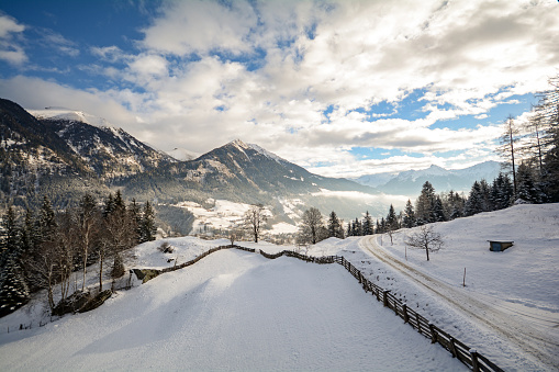 Winter landscape with icy road near Salzburg in Austria, Europe