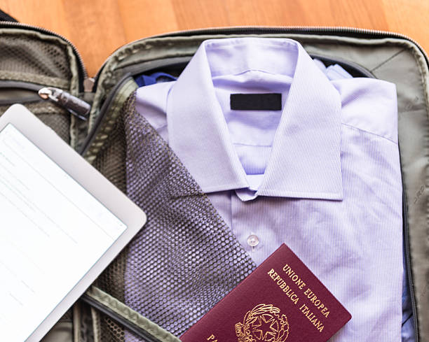istock Businessman's clothes in travel bag 622787612