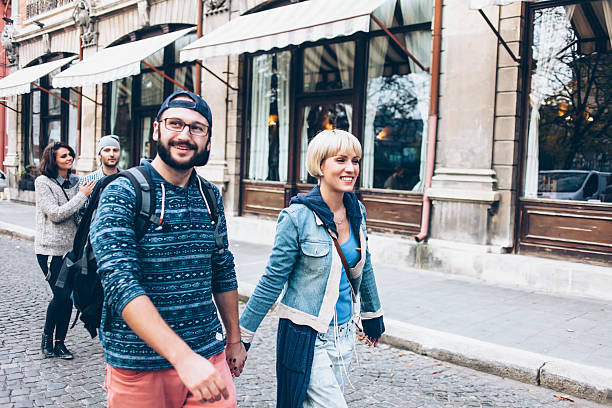 istock Smiling young people walking on streets 622788346