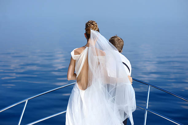 istock Happy bride and groom on a yacht 622789440