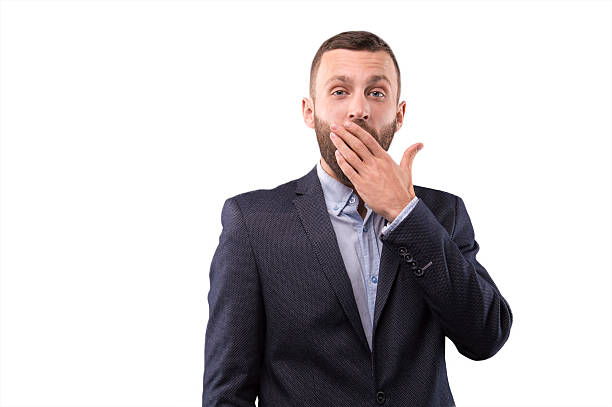 istock Man in a suit tired 622789576