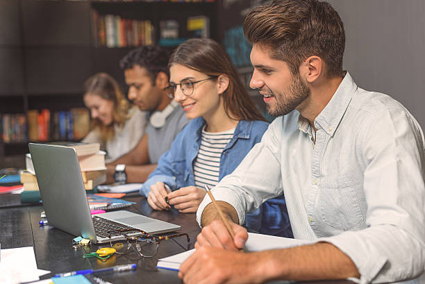 istock College students sitting together and studying 622790740