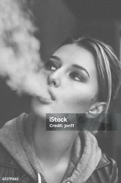 Young Woman Smoking Electronic Cigarette Stock Photo - Download Image Now - Black And White, Fashion, 20-24 Years