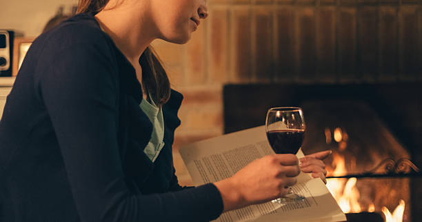 Relaxed girl at home drinking red wine