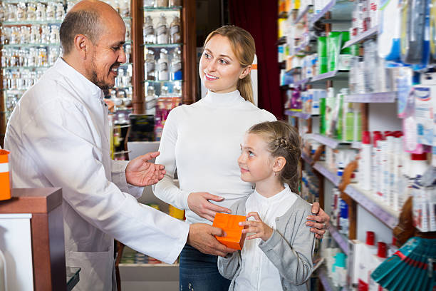 istock Mature male pharmacist helping customers 622792866