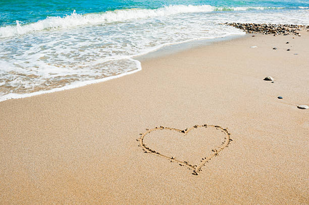 istock Shape of heart on the beach 622795678