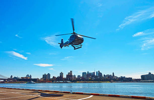 Black Helicopter taking off from helipad in Lower Manhattan
