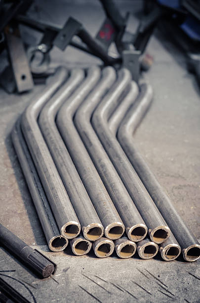 istock Round bent steel pipe on aluminium plate 622796350