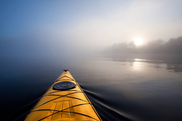 Kayaking in the fog. stock photo