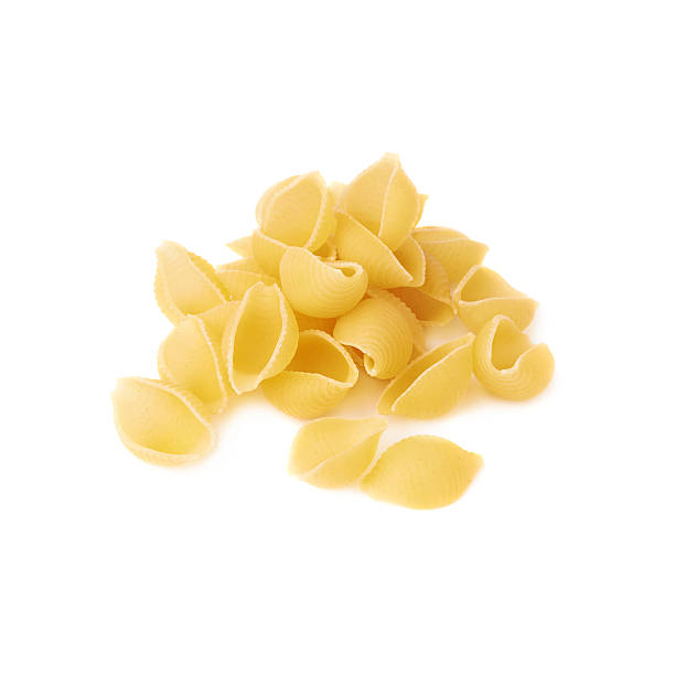 istock Pile of dry conchiglie pasta over isolated white background 622799404