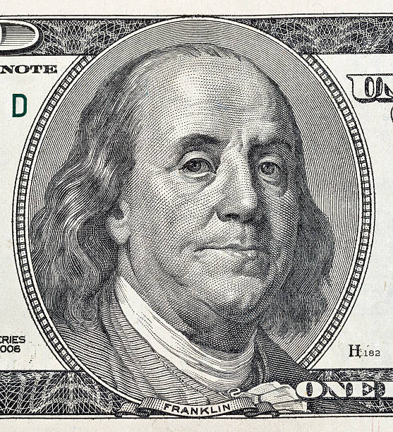 istock Benjamin Franklin portrait on one hundred dollar bill closeup 622800414